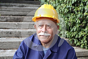 Senior man with a mustache doing construction work