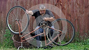 Senior man is nervous about very old bicycle to repair