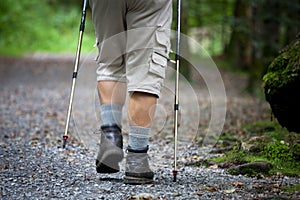 Senior man nordic walking outdoors