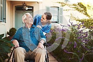 Senior man, nurse and wheelchair for healthcare support, life insurance or garden walk at nursing home. Happy elderly