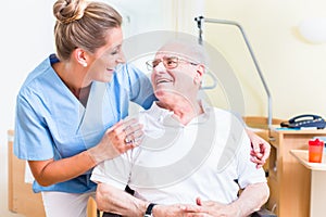 Senior man and old age nurse in nursing home