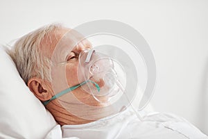 Senior Man with Oxygen Mask Side View