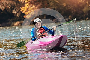 Senior man paddling kayak. Gray hair man enjoy river kayaking