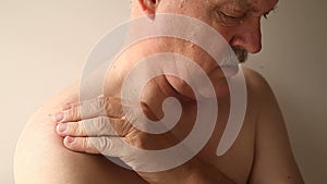 Senior man with pain in his shoulder