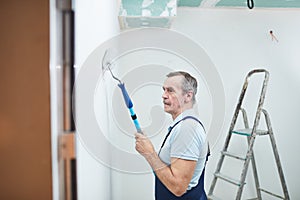 Senior Man Painting Walls