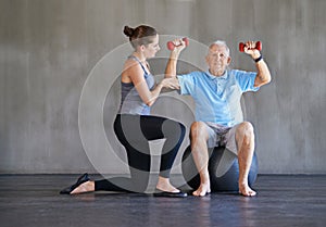 Senior man, physical therapy or dumbbells for health, fitness or medical assessment on wall background. Physiotherapy