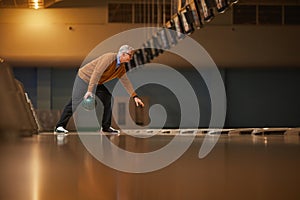 Senior Man Playing Bowling Side View