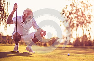 Senior man playing golf