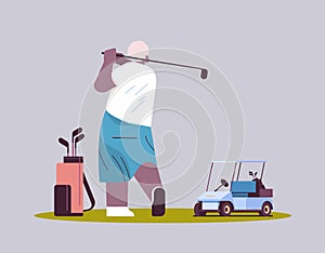 senior man playing golf aged african american player taking a shot active old age concept horizontal full length