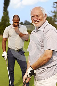 Senior man playing golf