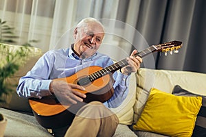 Senior man playing guitar