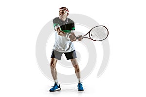 Senior man playing tennis in sportwear isolated on white background