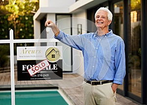 Senior man, portrait and keys with house sold sign for new home, real estate and relocation. Male person, happy or