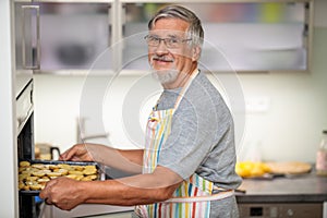 Senior man prepares healthy version of potatoes