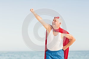 Senior man pretending to be a superhero