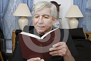 Senior man reading Bible