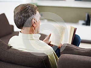 Senior man reading book