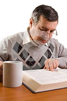 Senior man reading a book