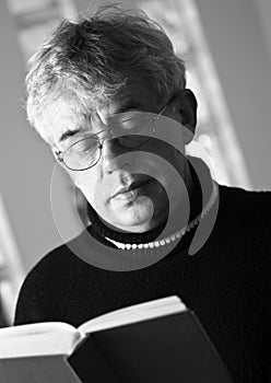 Senior man reading book