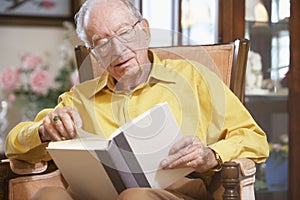 Senior man reading book