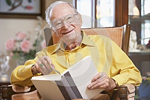 Senior man reading book