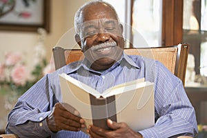 Senior man reading book