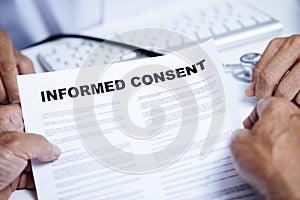 Senior man reading an informed consent