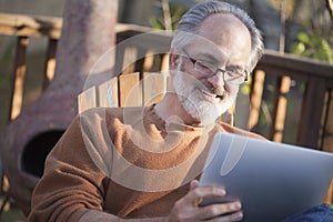 Senior man reading a net book