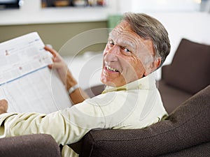 Senior man reading newspaper