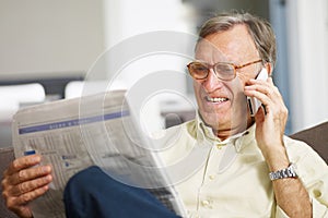 Senior man reading stock listings