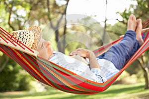 Senior Man Relaxing In Hammock