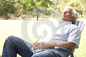 Senior Man Relaxing In Park