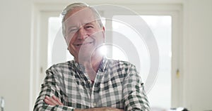 Senior man, relaxing and smile in portrait, happy and pride in apartment, joy and home or peace. Elderly person, laugh