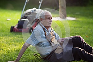 Senior man resting on lawn
