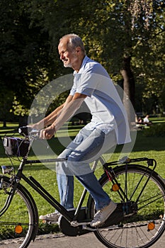 Senior Man Riding Bicycle