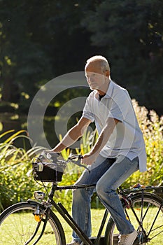 Senior Man Riding Bicycle