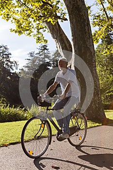 Senior Man Riding Bicycle