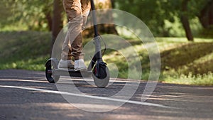 Senior man riding electric kick scooter