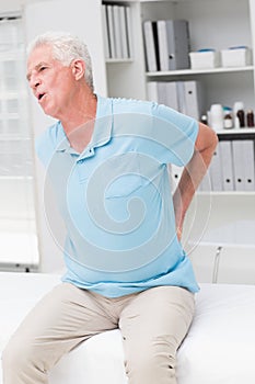 Senior man screaming due to back pain