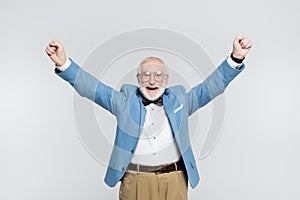 Senior man showing yeah gesture isolated