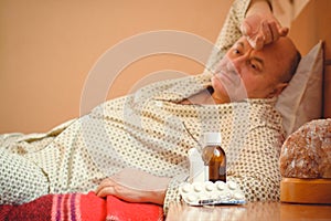 Senior man sick, bed health, concept of old people life