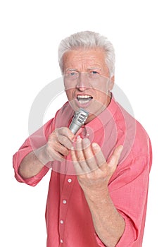 Senior man singing with microphone