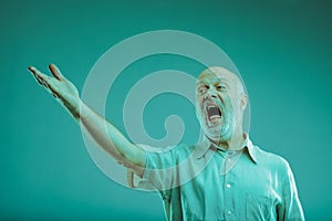 Senior man singing or screaming at someone gesturing with hand