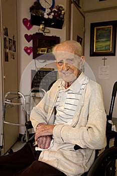 Senior Man Sitting in Wheel Chair in Care Facility