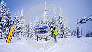 Senior man skier skiing in the West Bowl high alpine ski area at Sun Peaks