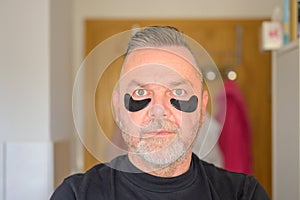Senior man in a skin care and anti-ageing concept