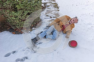 Senior man slipping on ice on his walkway