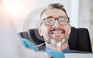 Senior man, smile and teeth, dentist and metal tools with health consultation, dental and oral care at clinic