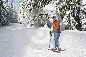 Senior man snowshoeing