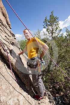 Senior man starting rock climb in Colorado